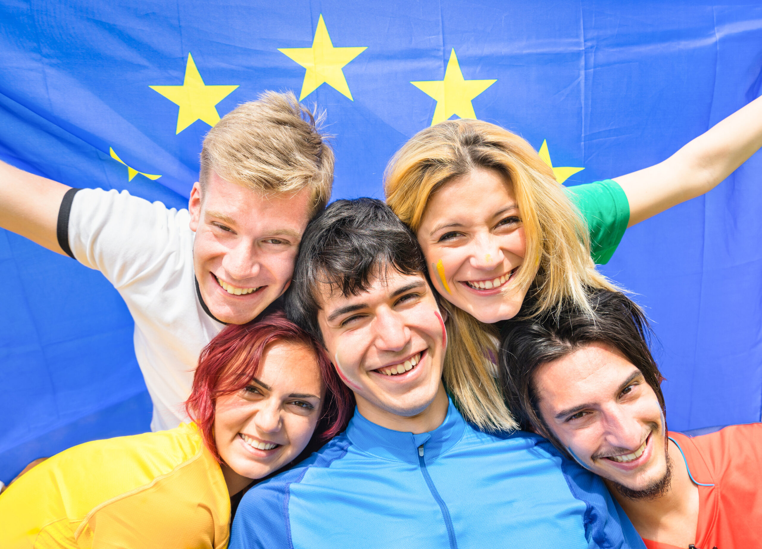 Young people cheering with european flag.
